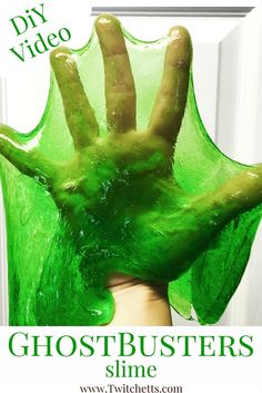 a hand covered in green liquid with the words diy video ghostbusters slime