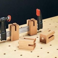 several pieces of wood being worked on with tools