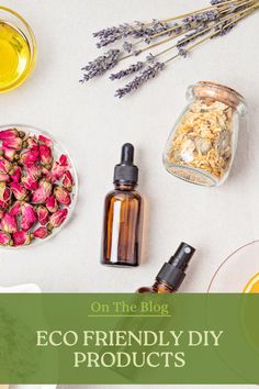 an assortment of essential oils and flowers on a table with text overlay that reads, on the blog eco friendly diy products