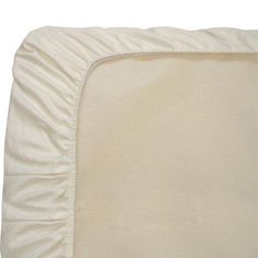 a white blanket with ruffled edges on top of it's back end and bottom edge