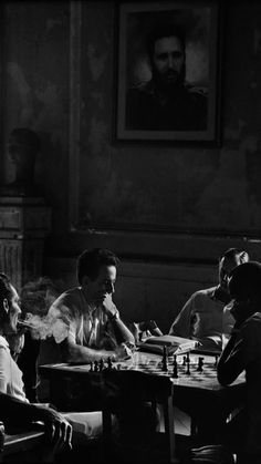 black and white photograph of men playing chess