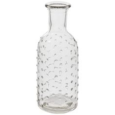 a clear glass bottle with holes on it