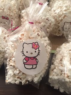 hello kitty popcorn balls are wrapped in cellophane and ready to be packaged up