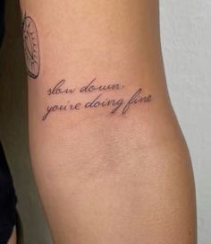 a tattoo saying slow down, you're doing fine