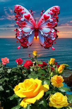 the butterfly is flying over some roses by the water with it's wings open