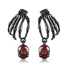 PRICES MAY VARY. 🎃Exquisite Design：Realistic skeleton earrings dangle set with sparkling blood red zirconia, showcasing a unique and spooky style. Skeleton hand earrings can be paired with fashionable outfits, showcasing your personality and fashion taste. Paired with a skull-inspired makeup, become the dazzling focus of Halloween night! 👻Material: 925 Sterling Silver. Our halloween skeleton earrings for women is crafted with high-quality silver and zircons, ensuring its glossiness and durabil Gothic Skull Earrings For Halloween, Black Gothic Earrings With Skull Print, Metal Skull Print Jewelry For Halloween, Edgy Halloween Drop Earrings, Edgy Drop Earrings For Halloween, Halloween Skull Print Earrings, Skeleton Jewelry, Gothic Party, Black Skeleton