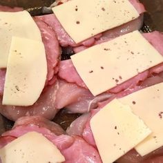 meat and cheese are being cooked in a pan