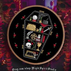 a cross - stitch pattern on a black background with an image of a clock and skulls