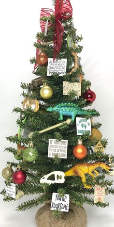 a christmas tree decorated with ornaments and greetings for someone's special holiday gift