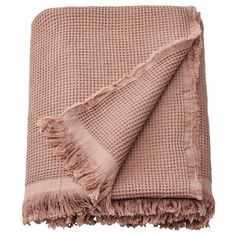 a pink blanket with fringes on it