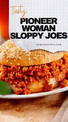 a sloppy joe sandwich on a plate with a piece of paper stuck to it's side