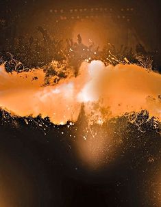 an orange and black abstract background with some white dots on it's edges in the foreground