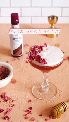 a pink moon souffle is sitting on a table next to some confetti