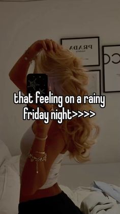 a woman taking a selfie with her cell phone while sitting on the bed and texting'that feeling on a rainy friday night > > > > > > > > > > >