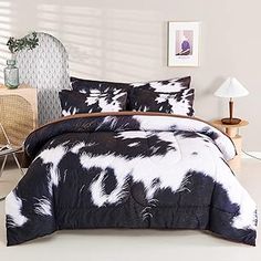 a black and white comforter set in a bedroom