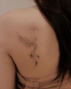 a woman with a tattoo on her back