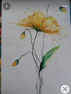 a drawing of a yellow flower with watercolors on the paper next to it