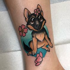 a small dog with flowers on its leg