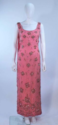 For Sale on 1stDibs - This Maxwell Shieff gown is composed of a pink embellished silk, with rhinestone and bead applique. There is a center back zipper and drape. In excellent Pink Embellished Silk Evening Dress, Festive Pink Evening Dress For Gala, Glamorous Pink Silk Gown, Pink Embellished Evening Dress, Pink Embellished Gown For Evening, Silk Prom Gown With Sequins, Pink Embellished Gown For Formal Occasions, 1950s Pink Evening Dress, 1950s Style Pink Evening Dresses