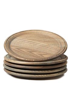 four wooden plates stacked on top of each other