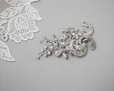 This bright bridal headpiece features crystal-covered scroll, flower, and round crystal stones sprays all set in silver plate.  This bridal clip measures about 3.5 inches long and 2 inches high. Flower Bridal Hair, Bridal Hair Flowers, Bridal Headpiece