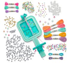 an assortment of crafting supplies including beads, scissors and bead sprinkles