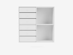 an empty white shelf with three drawers on each side and one drawer open to show the contents