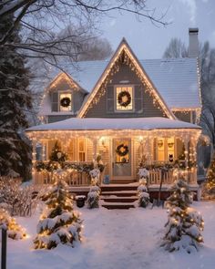 a house covered in christmas lights and wreaths