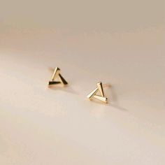 Beautiful gold polished triangle minimal earring Small Ring Earrings Gold, Earrings Design Gold Indian, Gold Minimal Earrings, Cute Small Earrings Studs, Small Tops Earrings Gold, Gold Small Earrings Studs, Ear Tops Gold Indian, Simple Earrings Gold Indian, Earrings Gold Indian Simple