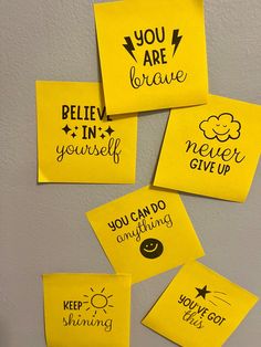 four yellow sticky notes that say you are brave, believe in yourself, never give up