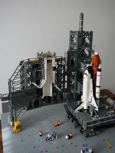 a lego model of a space shuttle on display