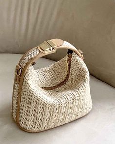 Description Woven handbagGold hardwareAdjustable chain strapZipper closureIncludes longer shoulder strap Approximate dimensions: 7.5"(L) 6"(H) 4"(W) Woven Beach Bags, Tas Bahu, Trendy Shoulder Bag, Woven Handbags, Straw Handbags, Trendy Handbags, Handbag For Women, Beach Bags, Casual Tote