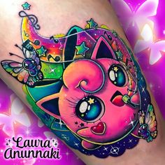 an artistic tattoo design on the leg of a woman's thigh with colorful designs