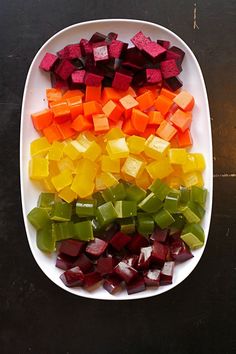 a white plate topped with cut up vegetables