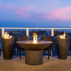 an outdoor fire pit on top of a building