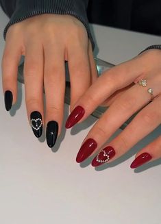 Looking for trendy Valentine’s Day nails that you can recreate at the salon? If so, you’ll love these cute and simple nail ideas, just like this black and red nail design with crystal hearts! Valentine Nails Art, Red Nails With Crystals, Nail Ideas Red And Black, Simple Red And Black Nails, Red Black Nail Art, Nail Red And Black, Red And Black Nails Ideas, Black And Red Nails Ideas, Nails Black And Red