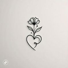 a heart shaped paper cut with flowers on it's side and the word love written in