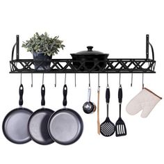 pots and pans are hanging on a rack