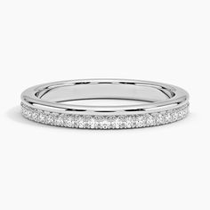 a white gold wedding band with rows of diamonds