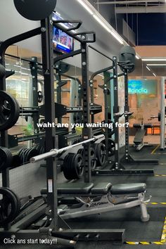 an empty gym with weight machines and barbells in the background that says, want are you waiting for?