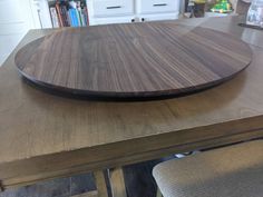 a wooden cutting board sitting on top of a table