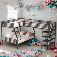 there is a bunk bed in the room with balloons all around it and decorations on the wall