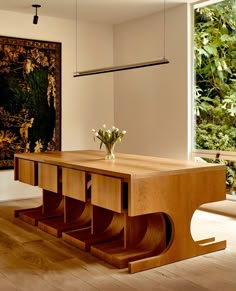 a wooden table sitting in the middle of a room