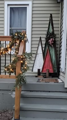 christmas decorations on the front steps of a house