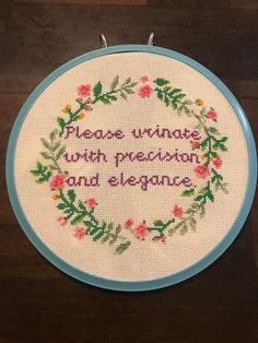 a cross - stitch hoop with the words please virnas with meaning and elegance