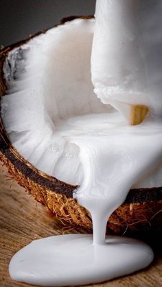 a coconut is being poured with milk