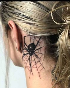 a woman with a spider tattoo on her neck