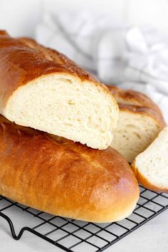 two loaves of bread on a cooling rack