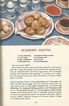 an advertisement for blueberry muffins on a table with cups and saucers