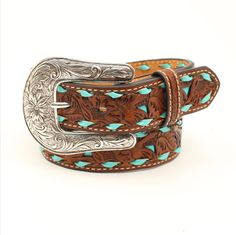 This Nocona Floral Pierced Strap Turquoise Buck Laced Edges Girls Belt & Buckle in Tan is the perfect accessory to add a western touch to any outfit. This belt features a tan floral pierced strap with a turquoise underlay and turquoise buck laced edges, giving it a unique and stylish look. It also has contrast stitching, a single leather keeper, and a silver interchangeable buckle. With a strap width of 1.25 inches, this belt is designed specifically for girls. Whether she's dressing up for a ro Country Girl Belts, Girls Belt Buckles, Country Belts, Tooled Belt, Nocona Belt, Rodeo Belt Buckles, Nocona Boots, Womens Belt Buckles, Custom Leather Belts